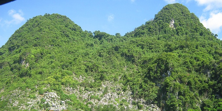 A view of majestic peaks adorned with lush greenery at Phong Nha-Ke Bang National Park.