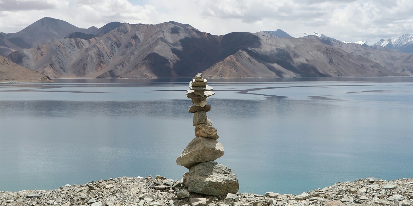 An image of a serene photography spot near Pangong Lake and stones