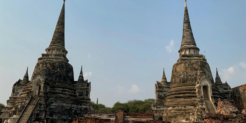 The Phra Mahathat Kaen Nakhon Stupa towers above the city with intricate Buddhist designs.
