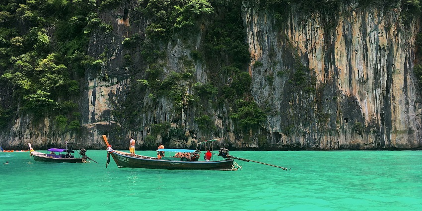 Tourists and locals are seen boating on the emerald waters of Pileh Lagoon, close to Viking Caves.