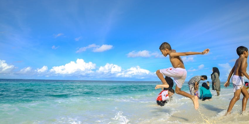 Things to do for kids in Maldives include enjoying fun-filled moments building sandcastles and playing by the shore.