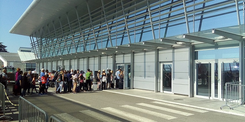 The beautiful entry gate of Podgorica International Airport on a bright, sunny day