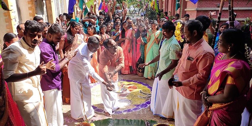 An image of a woman celebrating the Pongal festival, a famous festival in winter in India