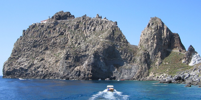 Ponza Island with a speeding boat, one of the islands in Italy for honeymoon.