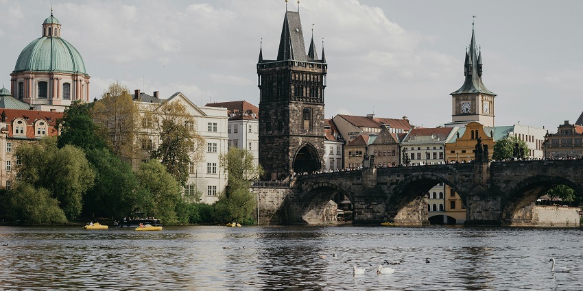 Prague Castle glowing at night, showcasing breathtaking architecture and historic charm.