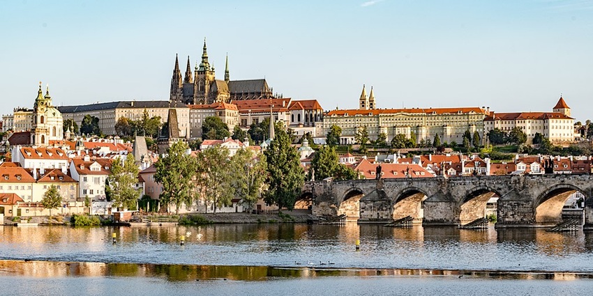 A fairy-tale city with gothic spires, cobblestone streets, and a historic astronomical clock