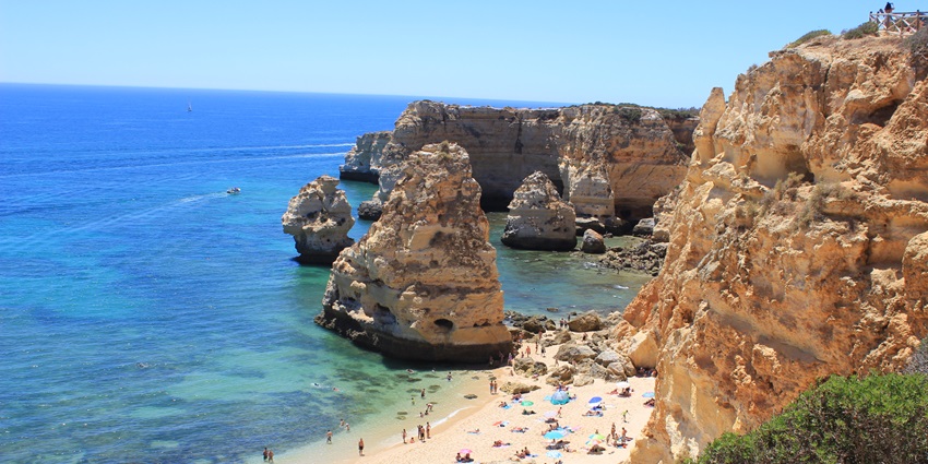 Beaches in Europe with golden cliffs, crystal-clear waters, and sea caves