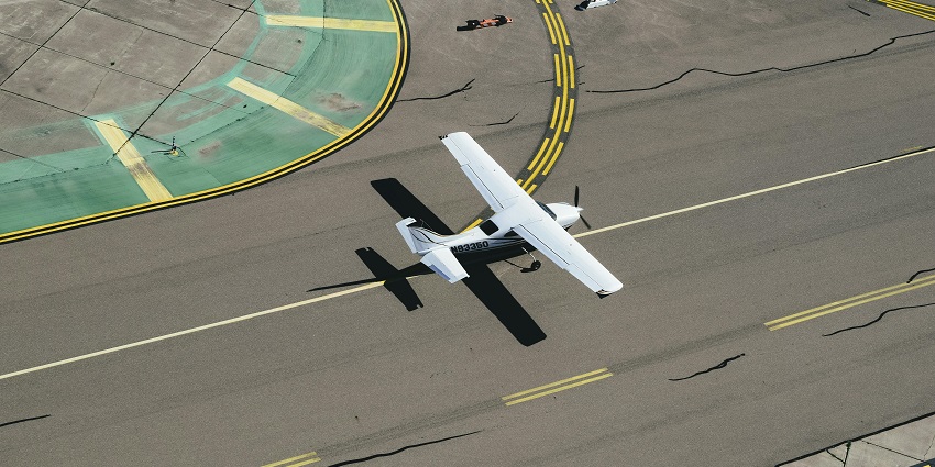 An aircraft with a sleek design, featuring a white body at one of the airports in Honduras.
