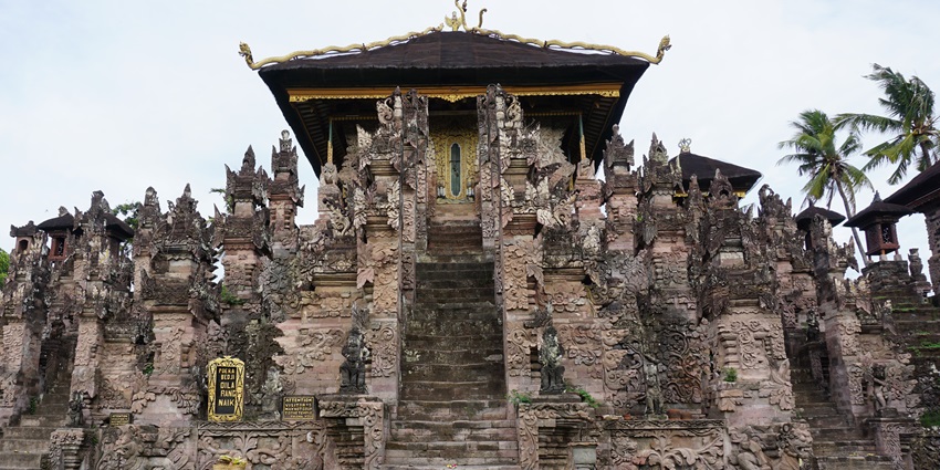 Discover stunning stone carvings and spiritual serenity at Pura Beji Temple.