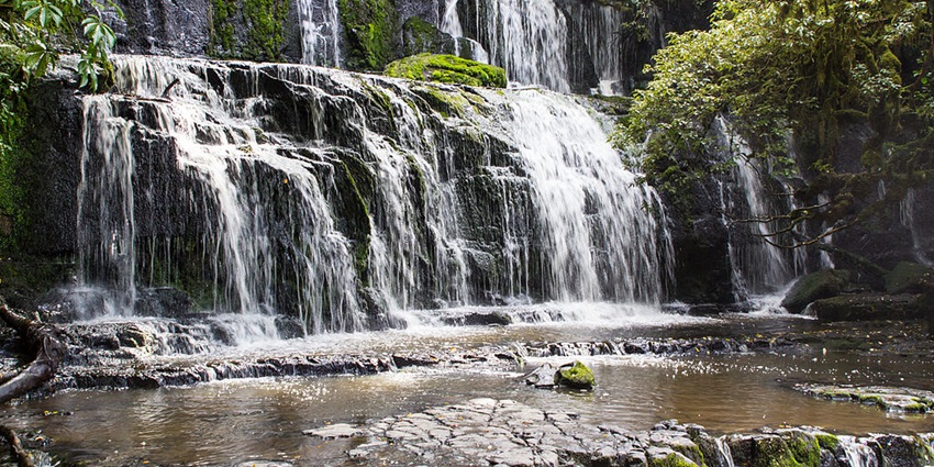 An image of Purakaunui Falls, a famous place near McLean Falls, with cascading water.