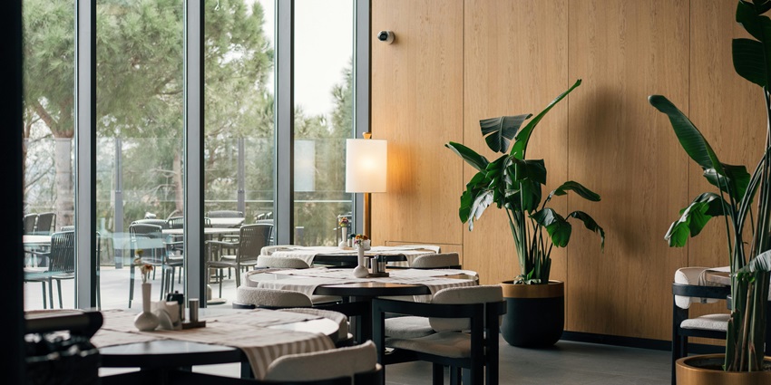 An amazing interior view of a cafe with modem furniture during the daytime.