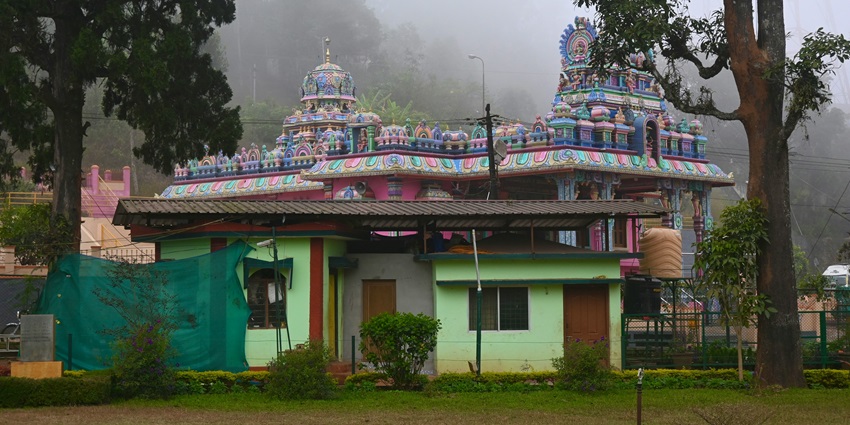 Cloudy skies over Raja’s Seat with misty hills and lush green valleys in Madikeri.