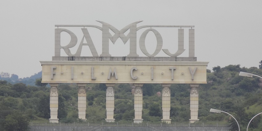 An image of a sculpted name of Ramoji Film City at its entrance located in Telangana.