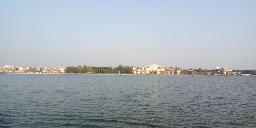 An image of Rankala Lake, with serene waters and a scenic promenade.