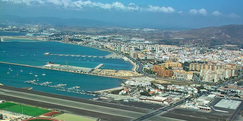 An aerial view of a scenic runway during daytime looking like a painted picture.