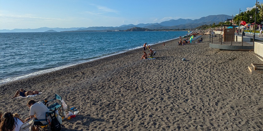 An image of Çalış Beach in Fethiye, Turkey, with golden sands and blue waters, showcasing Things To Do in Fethiye.