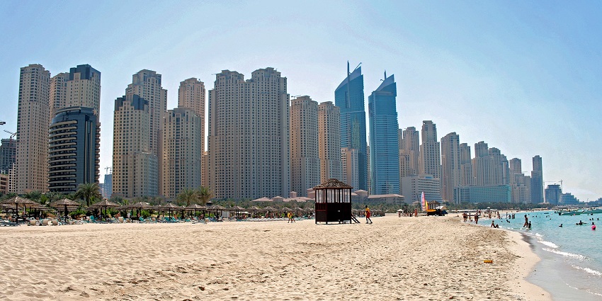 Things to do in Dubai in summer include unwinding on sandy shores with stunning views.