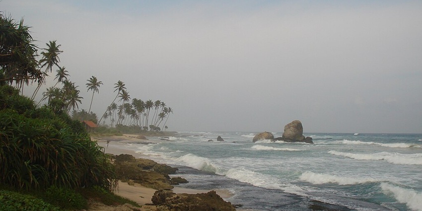 A day at Koggala Beach with golden sand and waves, one of the best things to do in Koggala