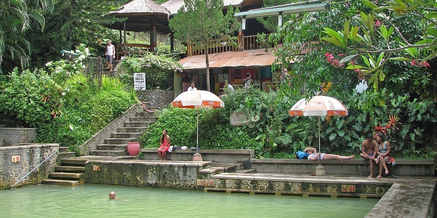 Soak in soothing, natural hot springs surrounded by lush scenery in Angseri Hot Spring.