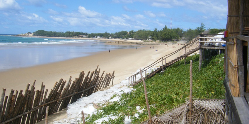 Unwinding on the golden sands of Praia do Tofo, where crystal-clear waters and gentle ocean breezes create the perfect tropical escape.