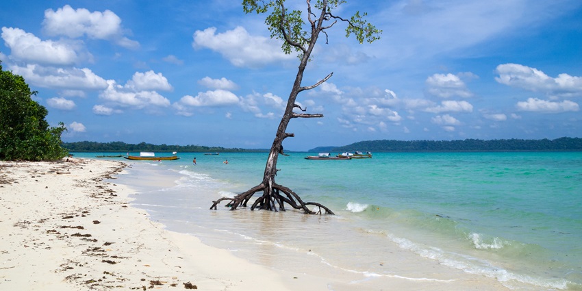 An image of a beach, where visitors can enjoy sunbathing and water sports.
