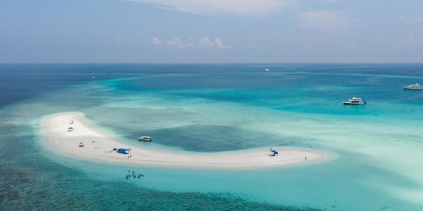 Unwind on a breathtaking sandbank with powdery white sand and crystal-clear waters.