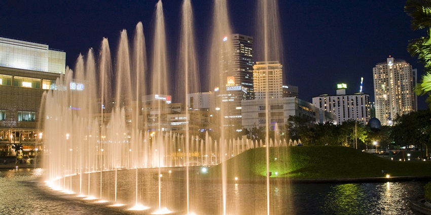 Fountains at KLCC Park with a backdrop of Kuala Lumpur's skyline near Petronas Twin Towers