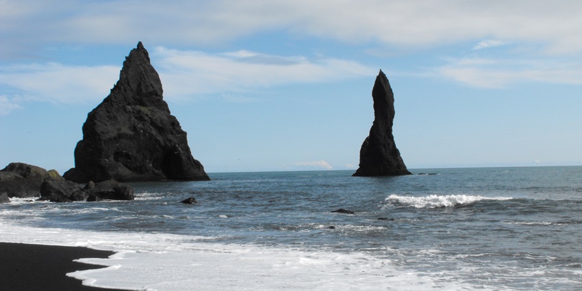 One of the best black sand beaches in the world, Reynisfjara Beach’s volcanic black sand meets powerful Atlantic waves and towering sea stacks.