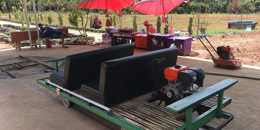 Bamboo Train at Battambang, with a wooden platform gliding on old train tracks.