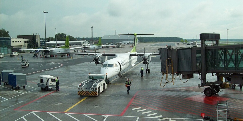 The airport ground crew preparing a plane for departure at Riga International Airport.