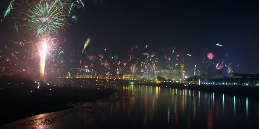 A glimpse of shimmering waters and colourful firecrackers being lit high up in the air.