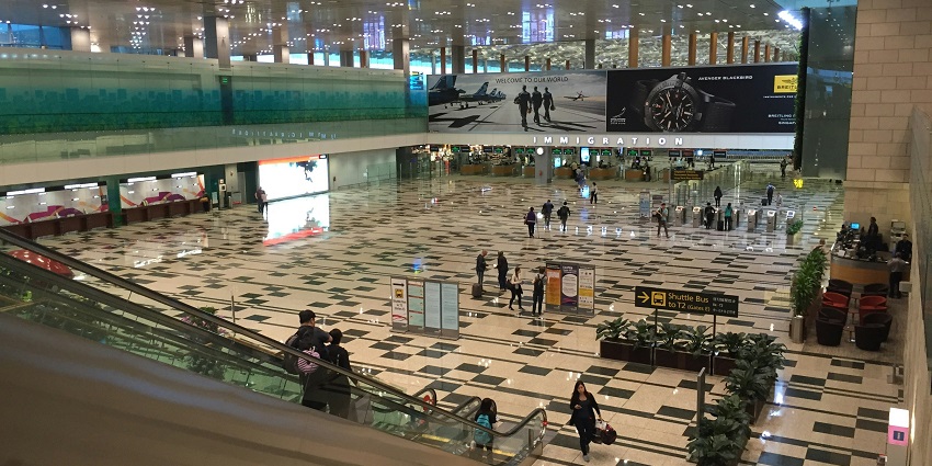Inside the halls of the Rodriguez Airport, with people wandering to their flights