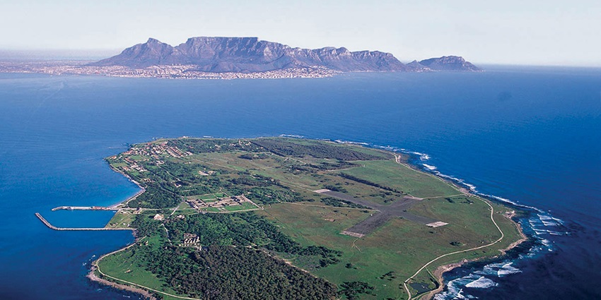 A historic island with a lighthouse and an old prison where Nelson Mandela was once held.