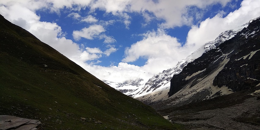 Rohru Chandernahan Lakes hidden with scattered rocks and snow-covered mountains