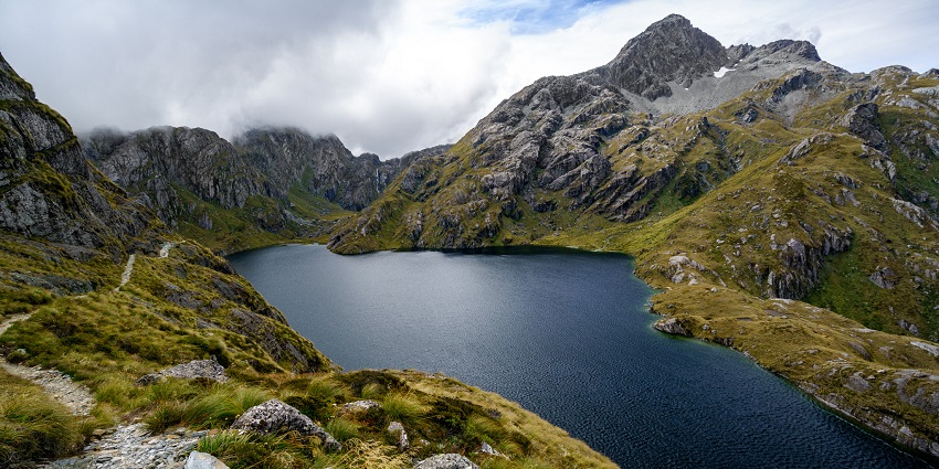 Lake Harris along the Routeburn Track, a well-known hiking route in New Zealand.