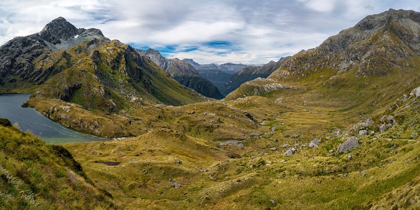 An image of a rugged mountain landscape of the Routeburn Track, with rocky peaks.