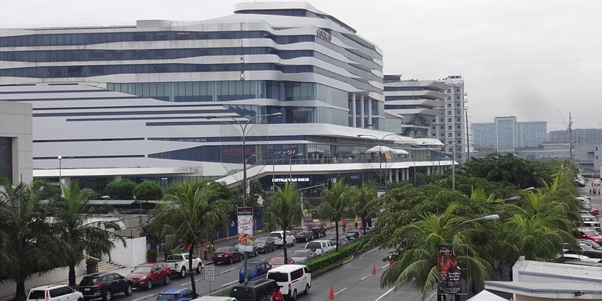 Wide angle distant view of the SM Mall of Asia with the clear sky in background