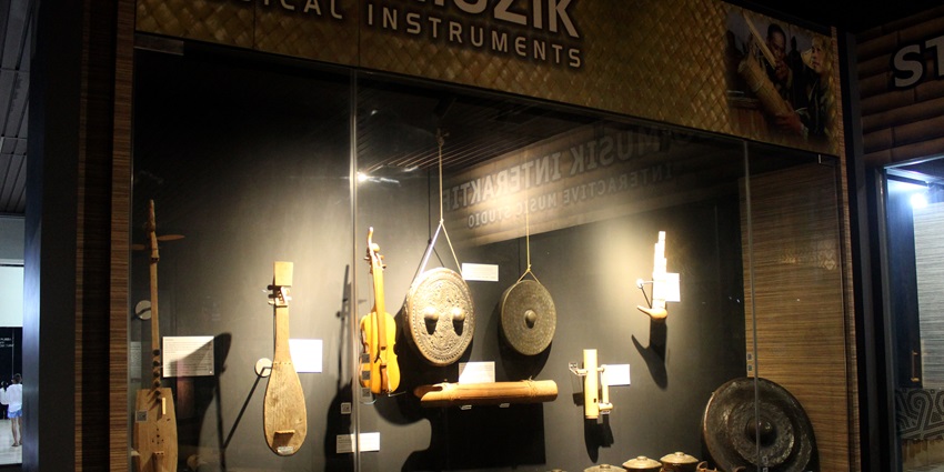 Artefacts and hunter weapons displayed at Sabah State Museum near Kinabalu