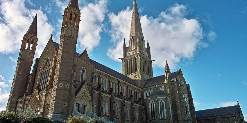 Sacred Heart Cathedral, one of the churches in Australia, showcasing Gothic Revival elements under a bright sky.