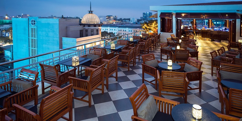 An image showing Saigon Saigon Rooftop Bar with city views and a setting ready to start the evening.