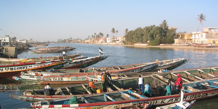 A colonial-era town with colorful buildings, jazz festivals, and scenic river views.