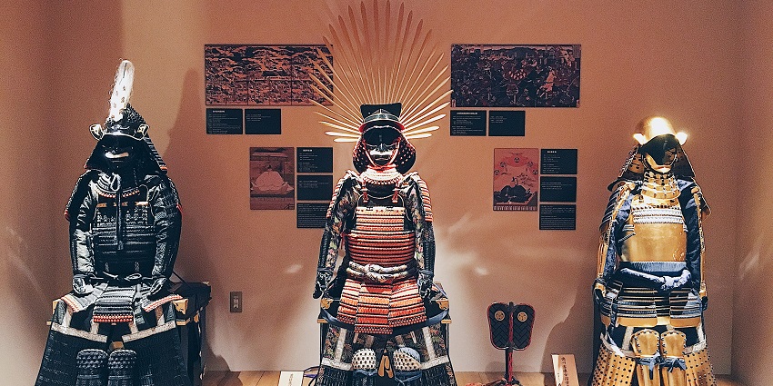 Three intricately designed traditional Japanese samurai at one of the museums in Japan.