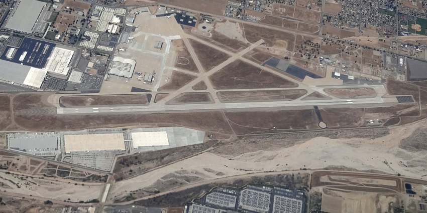 A glimpse of San Bernardino from above with long runways of airport and buildings.