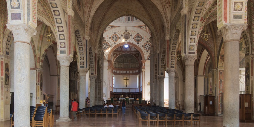 The grand nave of Milan’s Santa Maria delle Grazie with beautifully carved walls.