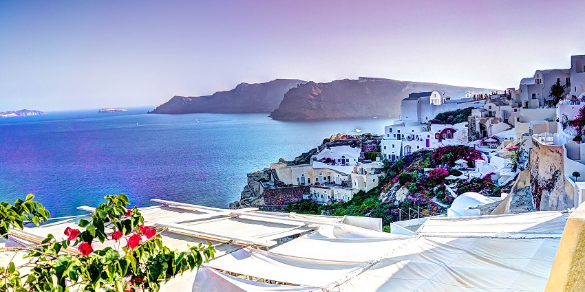 Romantic Santorini sunset with ocean views, ideal for couples seeking beach wedding destinations in the world.