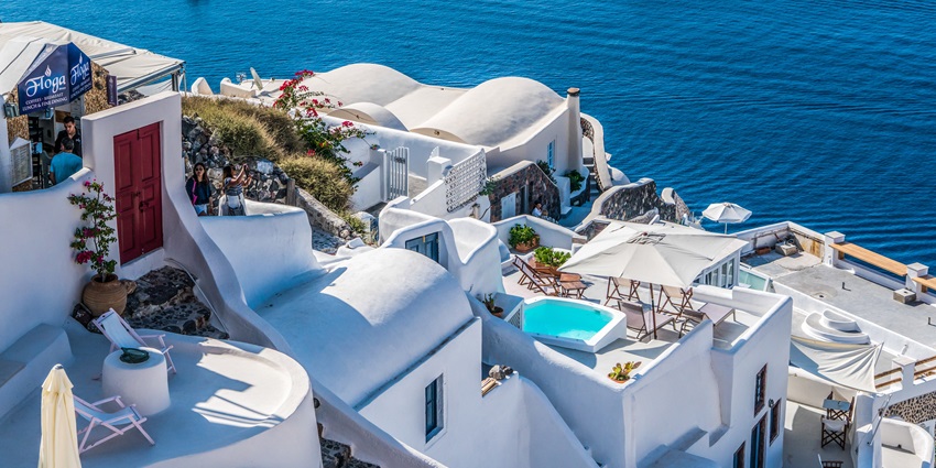 Admire iconic white-washed buildings, blue-domed churches, and mesmerising views.