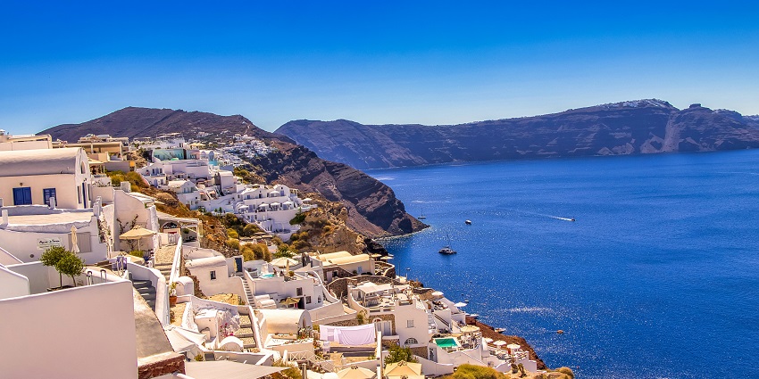 Sunset over Oia in Santorini- One of the best places to visit in June for couples in June
