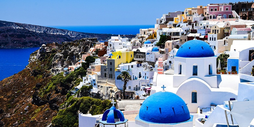 Admire whitewashed houses, blue-domed churches, and breathtaking sunsets in Santorini.