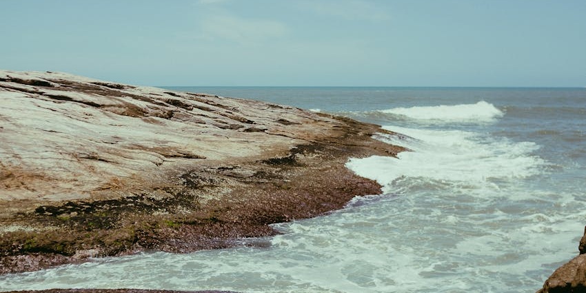 The powdery white sands of Sao Beach in Phu Quoc, with turquoise waters gently lapping the shore.