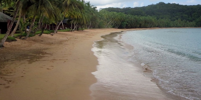 A lush volcanic island with unspoiled beaches, dense rainforests, and cocoa plantations.